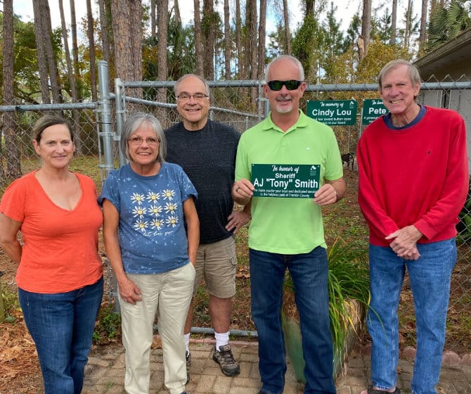 Aj Tony Smith and FCHS team with memorial plaque