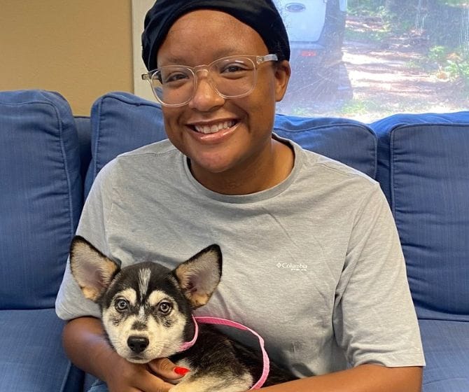 Girl holding new dog
