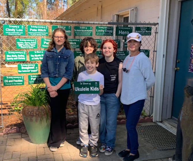 Happy family with plaque